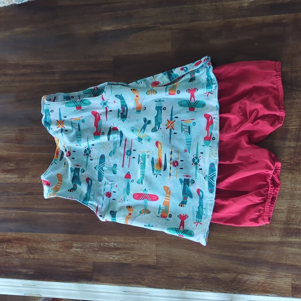 Sassy Stitches smocked short swing top set with airplanes size 3/3T red shorts